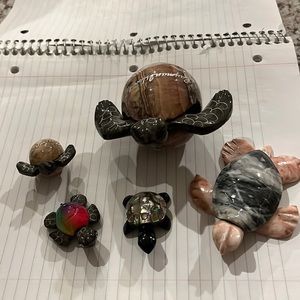 Collection of natural stone sea turtles.
